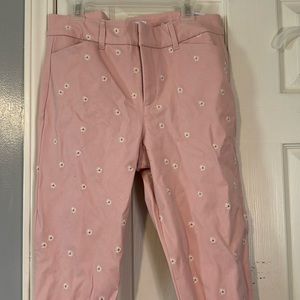 pink dress pants with embroidered daisy details